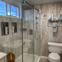 Abbey Shale 24x16 shower and bathroom surrounds with a transom window