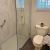 Fixed glass shower panel bianco marble wall panels | Innovate Building Solutions | Bathroom Remodel | Innovastone base | White Slate with Bianco Marble