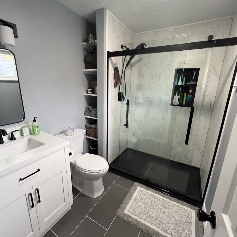 AFTER - shower, bianco marble wall panels with niche, new shower base, glass doors