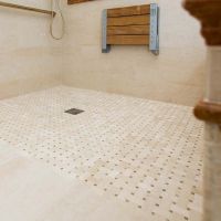 Roll in one level shower with mosaic tiles - The Bath Doctor 