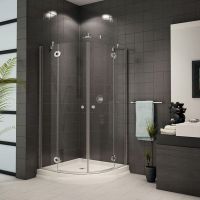 Curved sliding corner shower with a matching acrylic shower pan - Innovate Building Solutions 