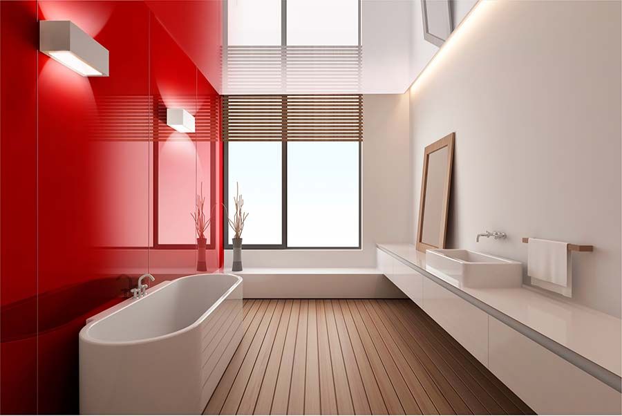 Red high gloss acrylic wall panels with a stand alone tub - Innovate Building Solutions 