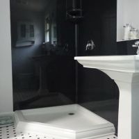 Black - constellation pattern' smooth gloss cultured granite wall panels with an acrylic shower pan