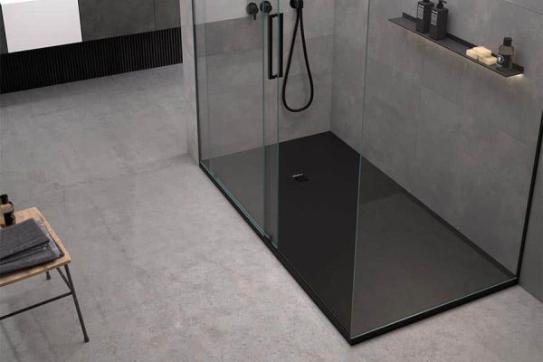 Matte black shower pan with walk in glass shower and laminate shower wall panels 