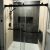 Matte black shower alcove glass bypass doors in a remodel and shower base in Cleveland Ohio - The Bath Doctor 