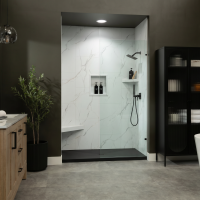 WhiteCarrara with a InnovaStone matte black bases center drain