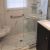 Gray and white cultured marble shower pan and shower wall panels - Innovate Building Solutions 