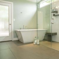 Arctic white shower surrounds with a one level wet room 