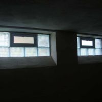 Diamond pattern glass block windows 32 x 14 size with a concrete wash in an unfinished basement - Innovate Building Solutions 
