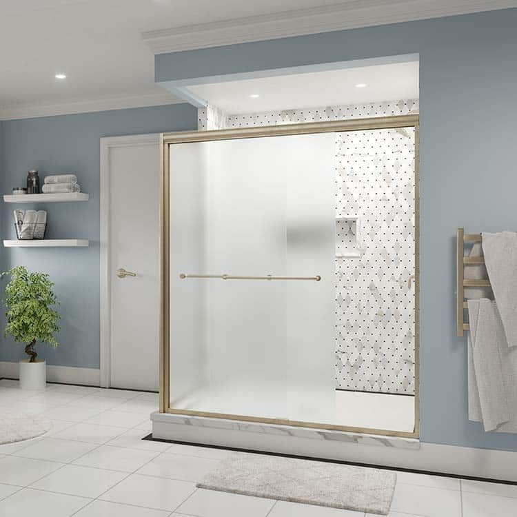 Semi-frameless bypass shower door in brushed bronze