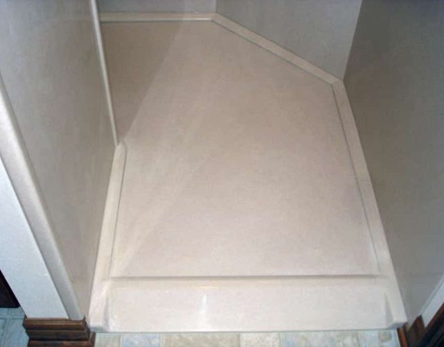 Custom angled roll-in shower for wheelchair access 