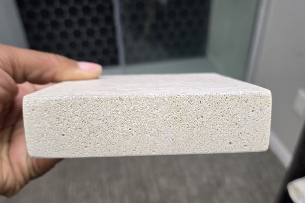 Closeup of GemStone solid surface shower pan material 