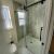 Matte black shower alcove glass Sliding doors in a remodel and shower base in Cleveland Ohio - The Bath Doctor 