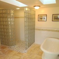 Slopped expended polystyrene tile ready shower pan and premade wave pattern glass block walls in New Hampshire - Innovate Building Solutions 