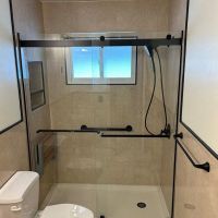 Travertine Shower Remodel_Black Accent Profiles and Shower Door | innovate building solutions, bathroom remodel, shower design ideas, travertine bathroom remodel, shower diy remodel