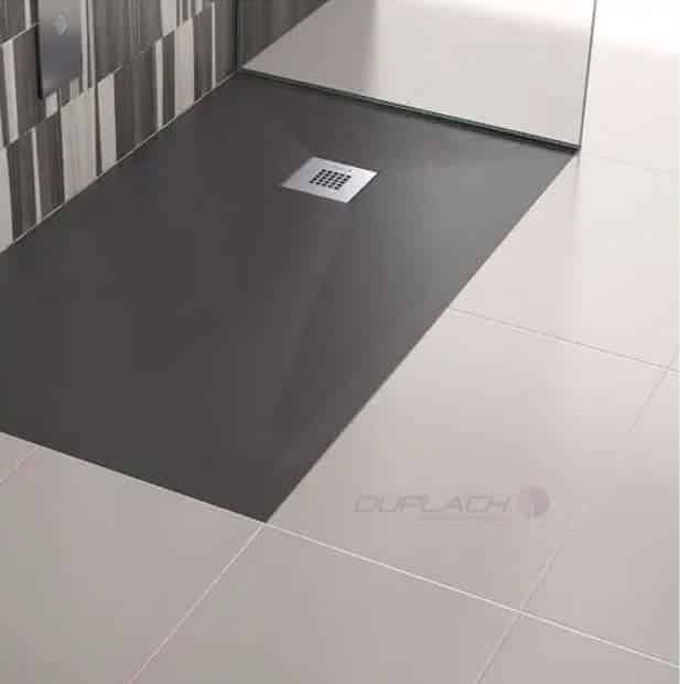 Recessed low profile shower base in matte black 60 x 32 size in a contemporary bathroom 