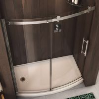 Curved barn door style glass shower door with a chrome finish - NV Collection by Innovate Building Solutions 