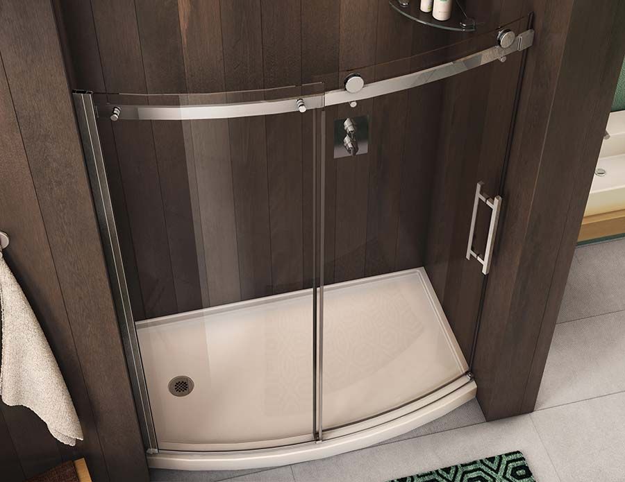 Brushed nickel curved sliding shower doors in a Richmond Height shower remodel - The Bath Doctor 