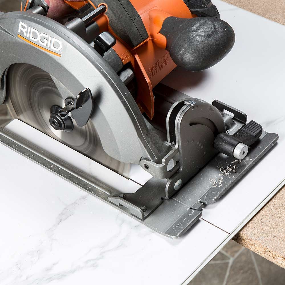 jig saw cutting a shower wall panel