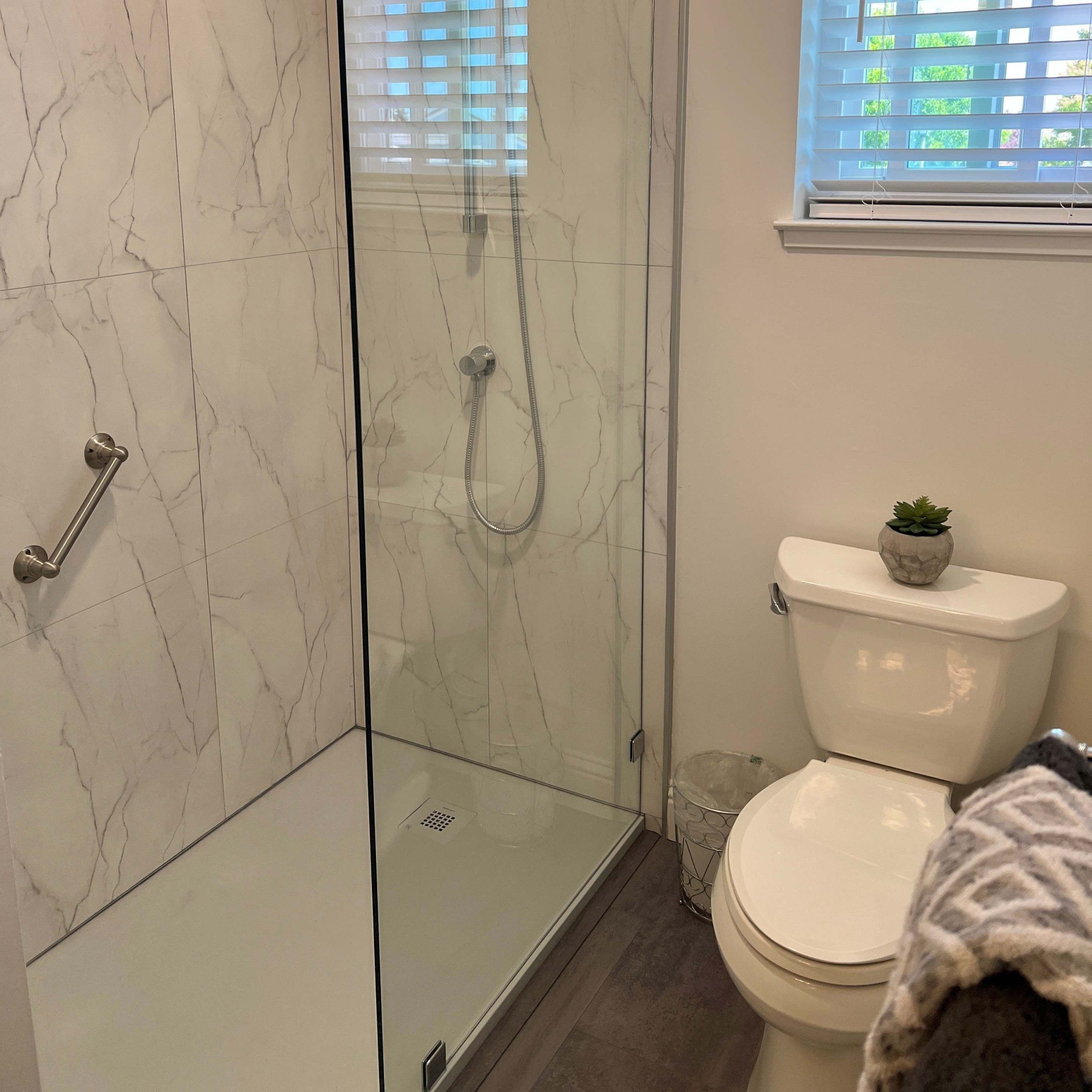 Fixed glass shower panel bianco marble wall panels | Innovate Building Solutions | Bathroom Remodel | Innovastone base | White Slate with Bianco Marble