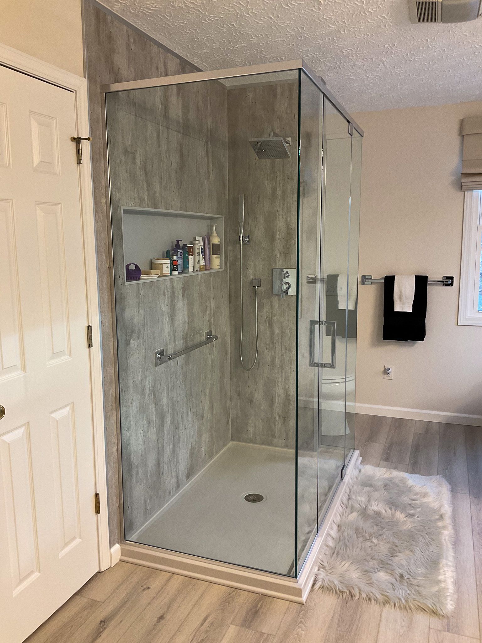 Pivot Glass Shower Door in Bathroom shower remodeling project in Akron Ohio