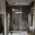 Walk-in alcove shower with glass shield and white pan