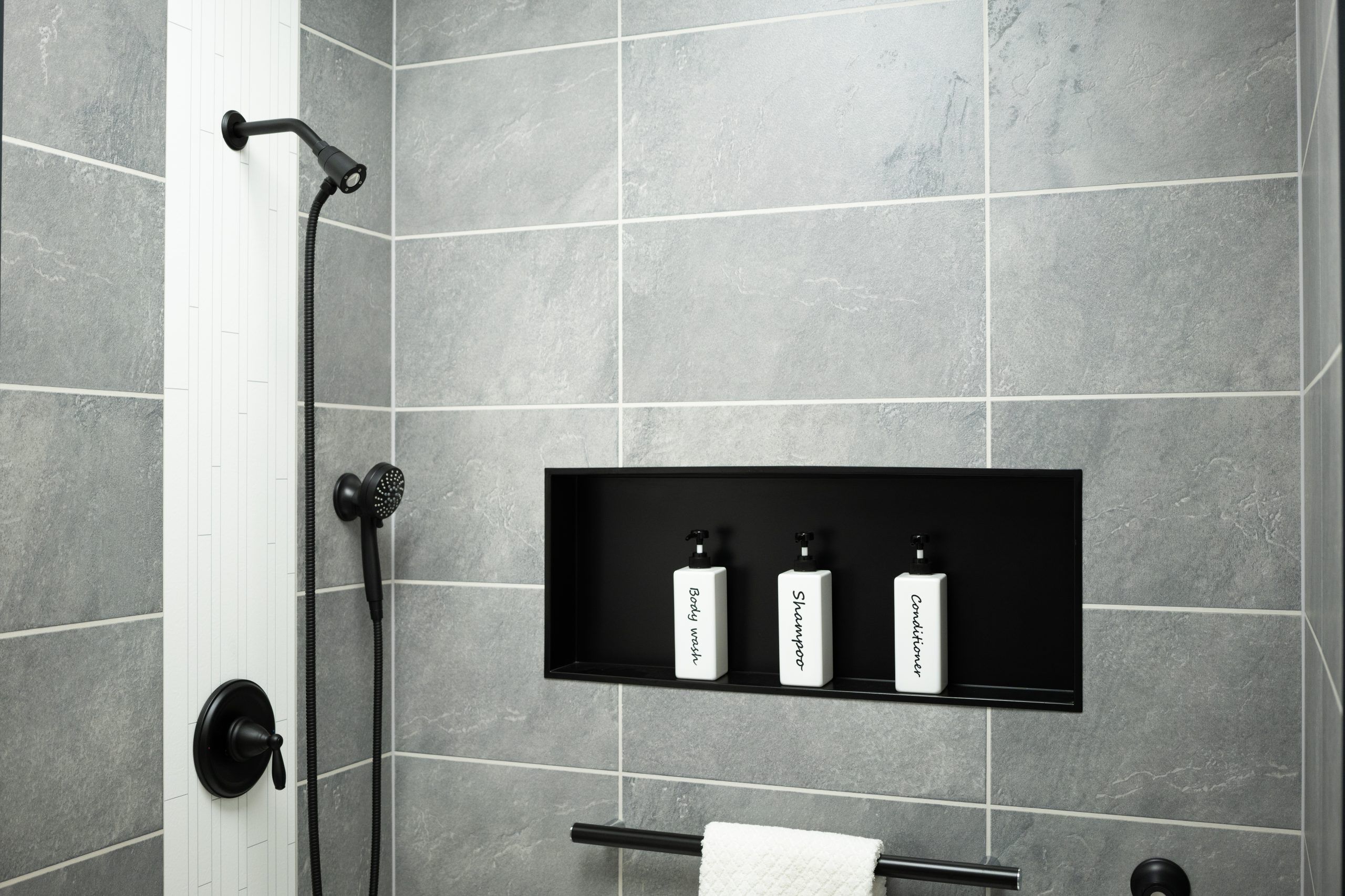 Black Slate  with White Decorative Accent Panel and Matte Black Niche Shower Design Remodeling in Cleveland, OH