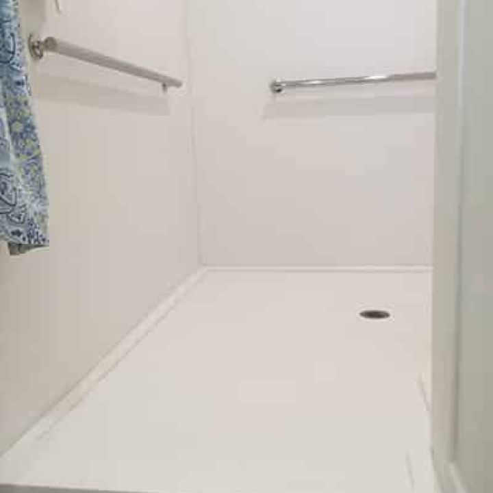 Custom low profile walk in cultured marble shower pan - Innovate Building Solutions 