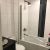 Bathtub replacement with grout free laminate shower panels in a Westlake Ohio bathroom - Bath Doctor bathtub replacement contractor 