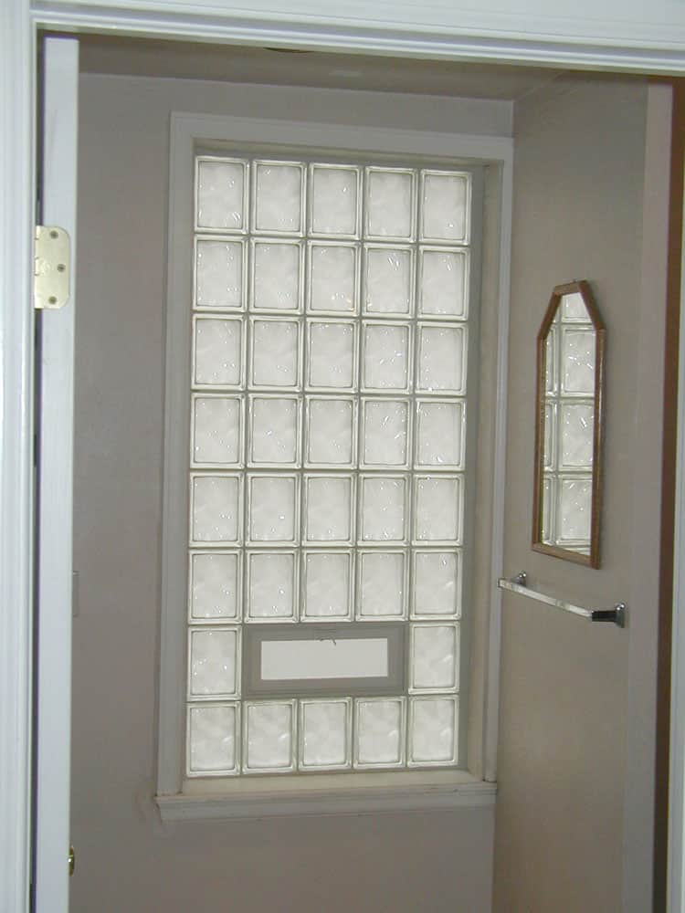 Glass block window using 6 x 8 sized blocks in a bathroom with vinyl window trim - Innovate Building Solutions 