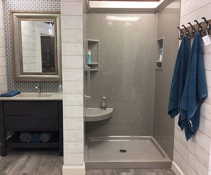 Cultured stone shower pan walls bench seat and niches with crown molding Cleveland Ohio 