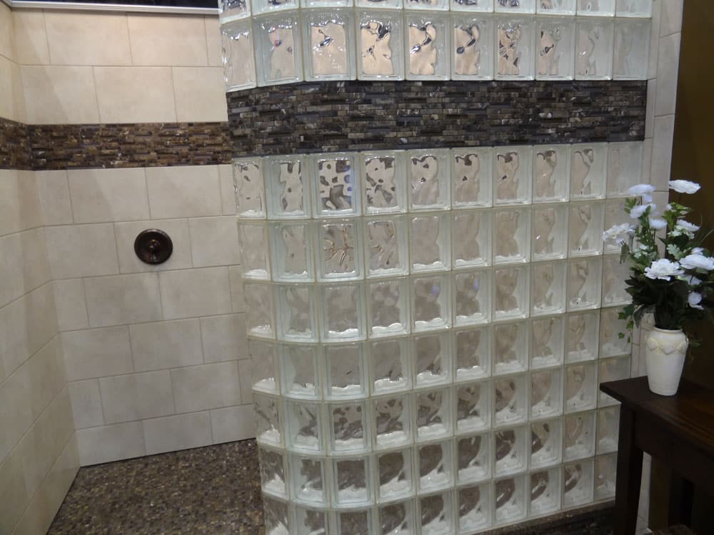 Glass block wall on a tile ready base with tile surrounds and a decorative border - Innovate Building Solutions 