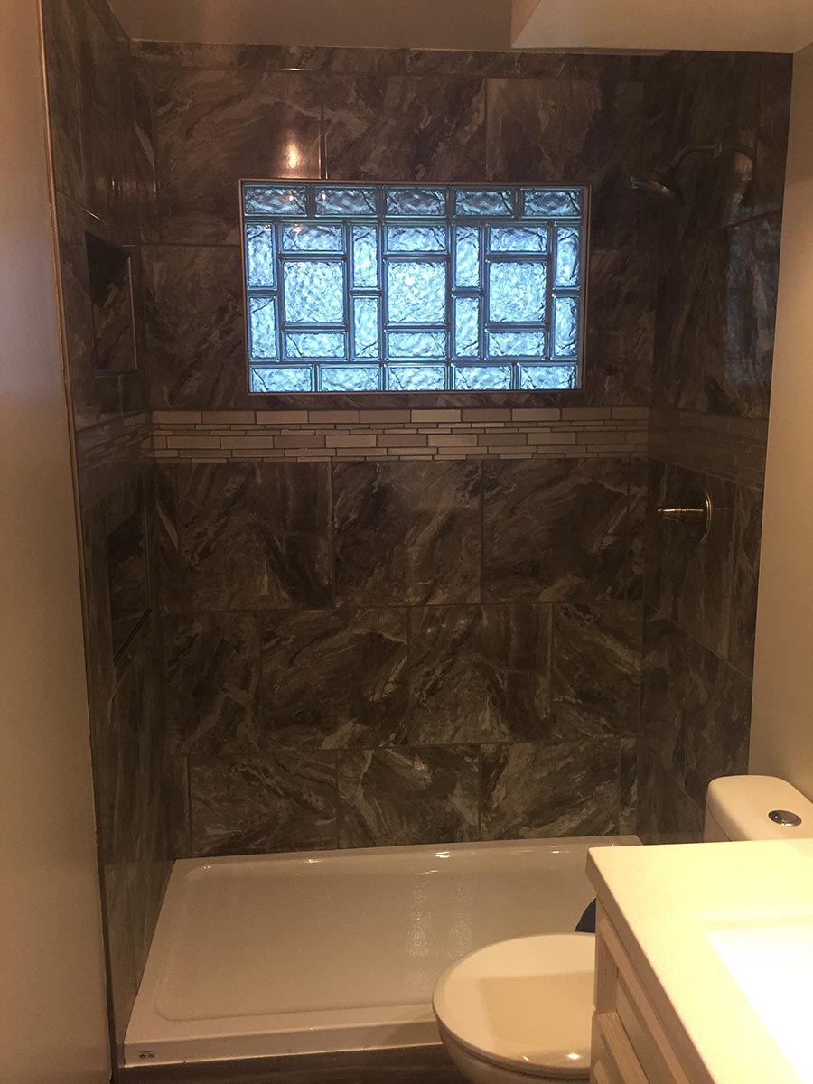 High privacy solid glass block window using 4 x 8 and 8 x 8 sizes in a shower - Innovate Building Solutions 