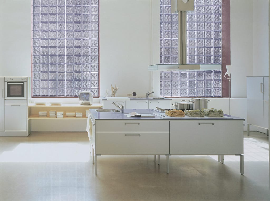 Euro styled kitchen with glass block window walls - Innovate Building Solutions 