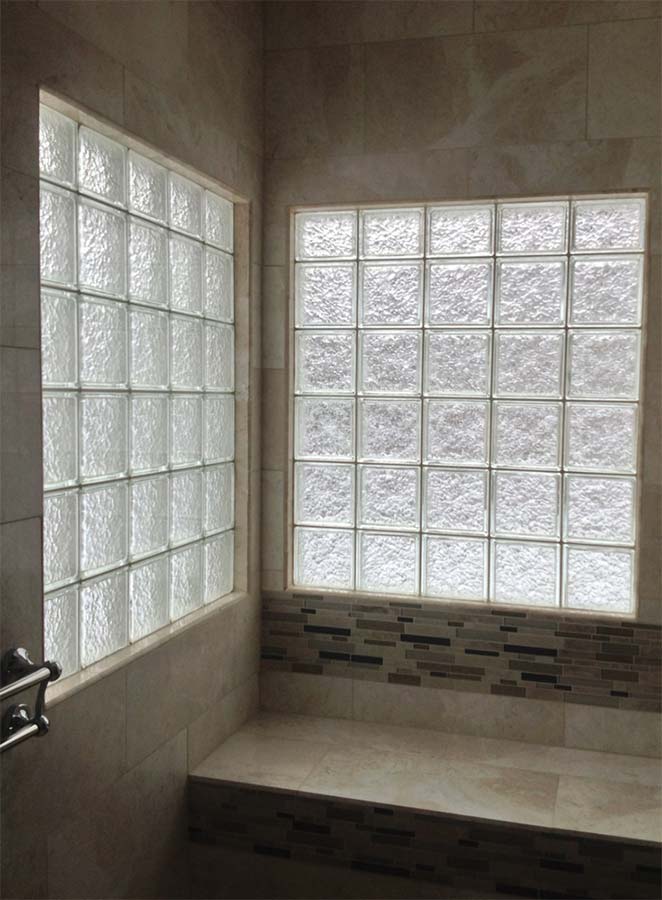 High privacy glass block shower windows with ceramic tile window trim in a ADA bathroom  - Innovate Building Solutions 