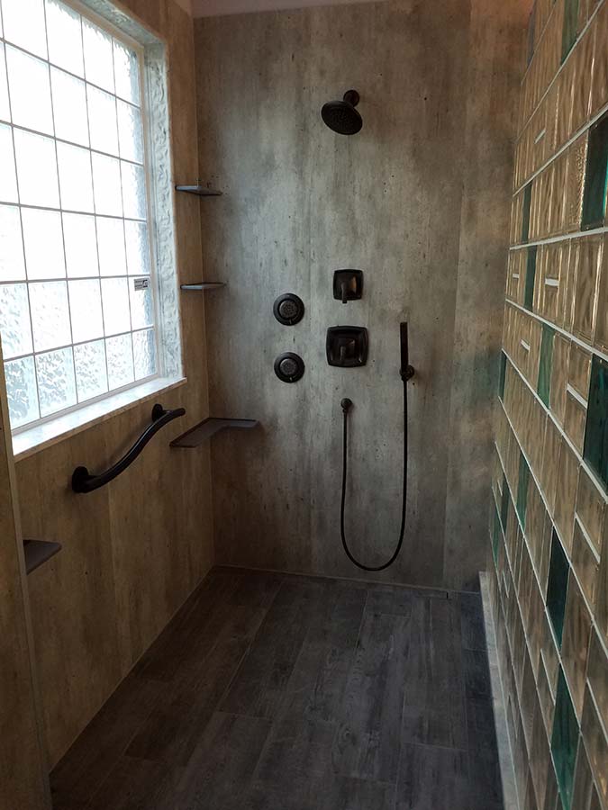 High privacy iceberg window with laminate wall panels in a glass block shower - Innovate Building Solutions 