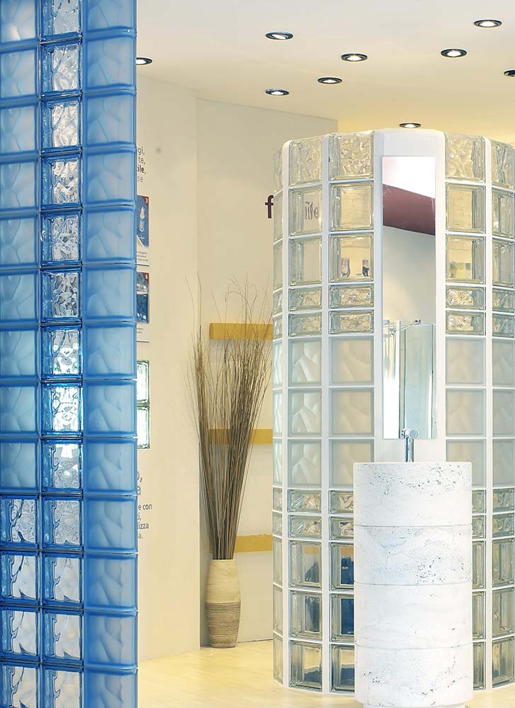 Blue frosted and wave blue colored glass block wall in a one level bathroom - Innovate Building Solutions 