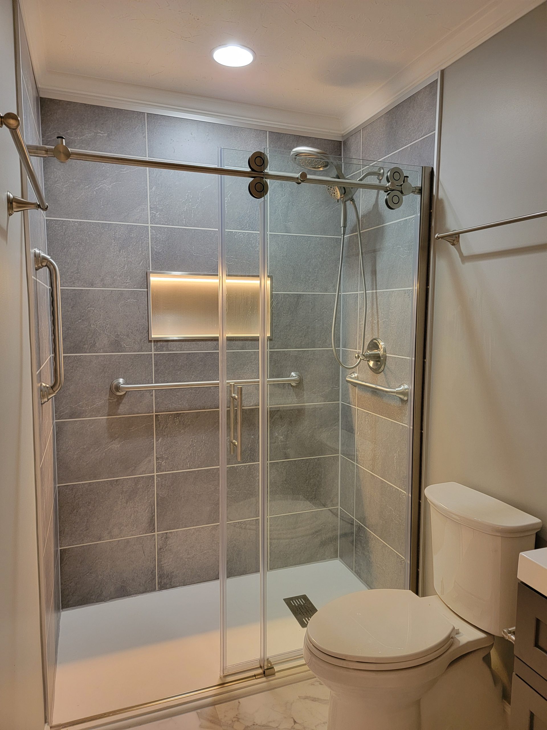 Modern low profile shower pan and sliding glass shower door