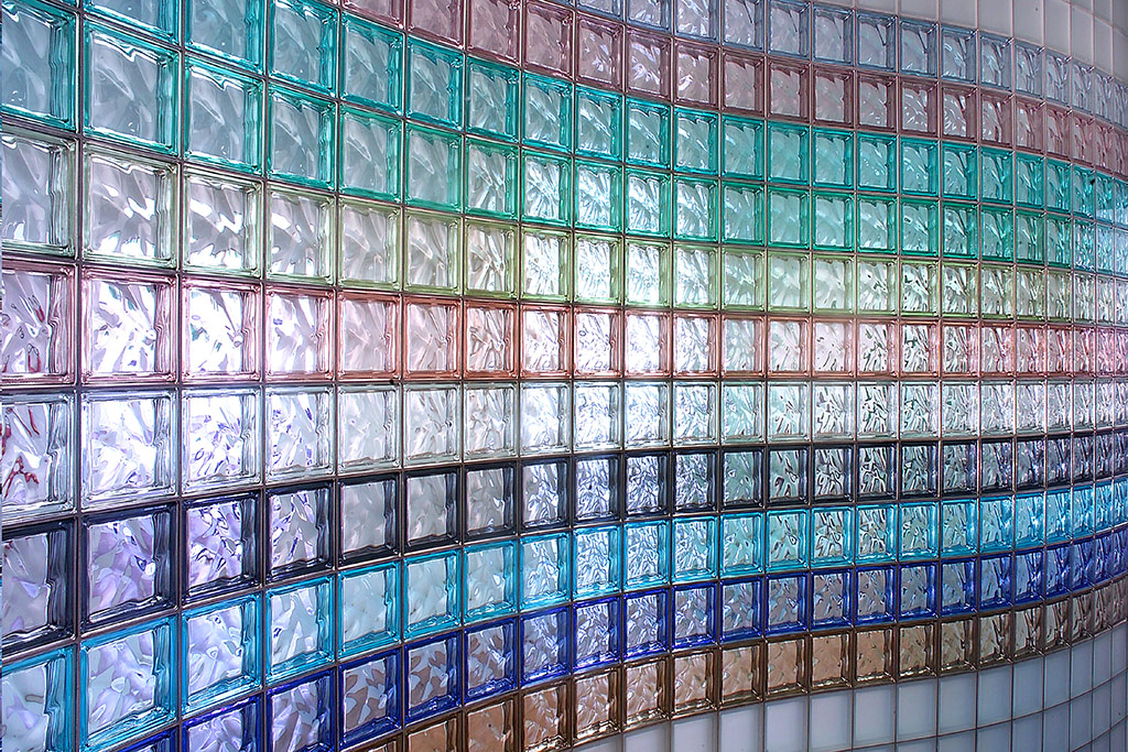 Multi-colored and curved glass block wall in a commercial building - Innovate Building Solutions 