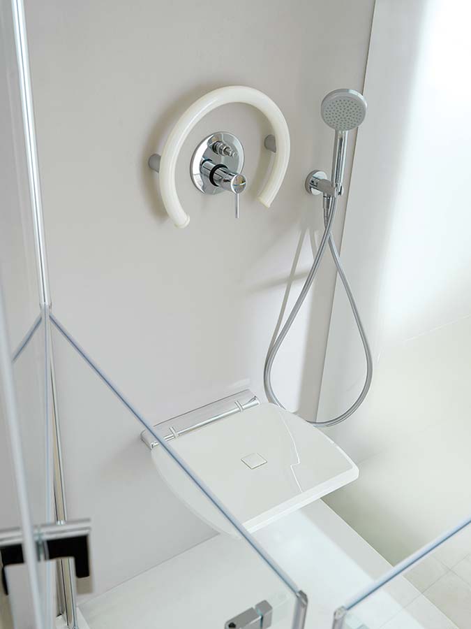 Polyurethane fold-down seat for a safe and contemporary shower - Innovate Building Solutions 
