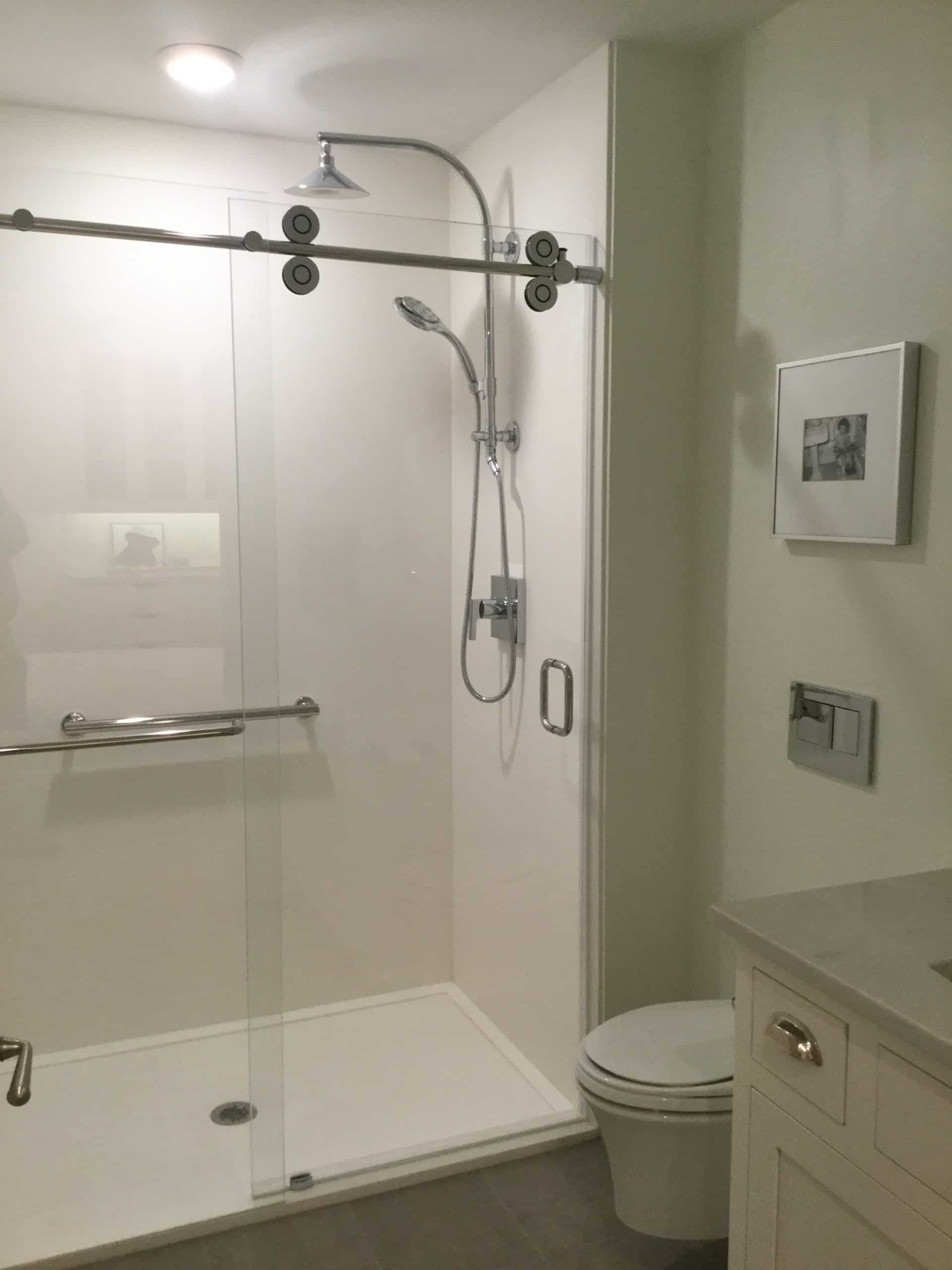 White cultured granite shower pan with a center drain - Innovate Building Solutions 