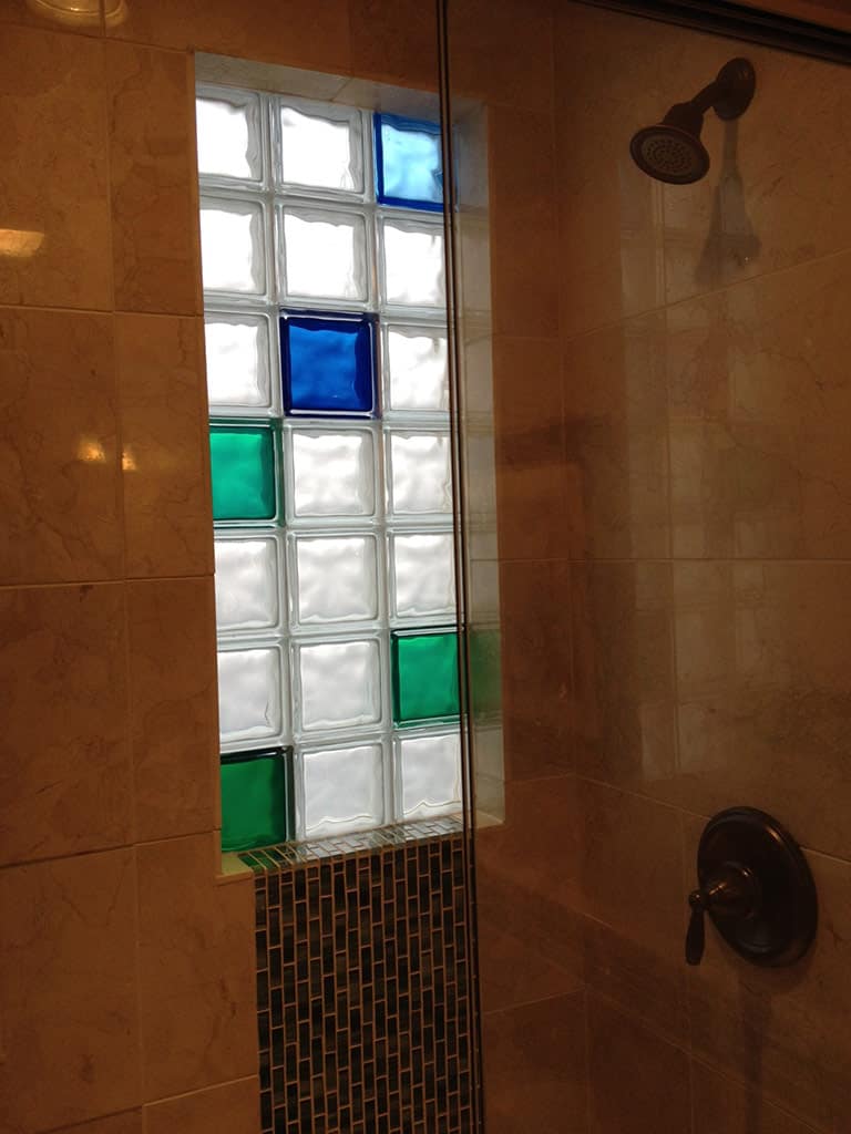 Light blue, blue and  green colored glass block shower window - Innovate Building Solutions 